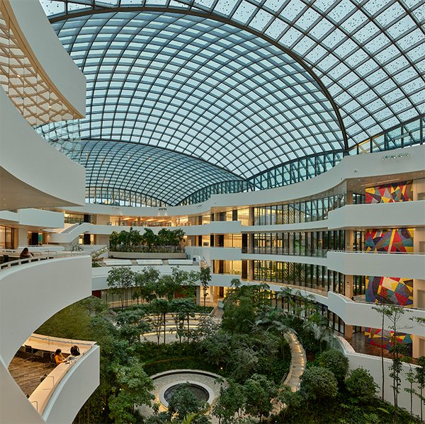 The atrium vaulting glass roof of the AELRC features an inventive shading system that evokes the feeling of gathering under a leafy tree.