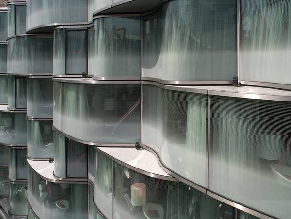 All together seele manufactured 500sqm wavy glass façade with fritted insulating units for the hotel wagram in paris.