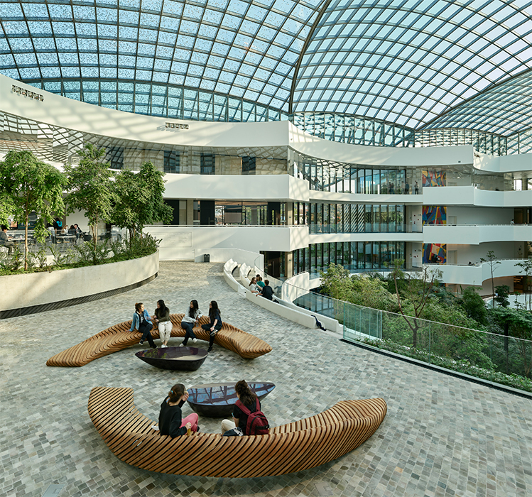 The atrium vaulting glass roof of the AELRC features an inventive shading system that evokes the feeling of gathering under a leafy tree.