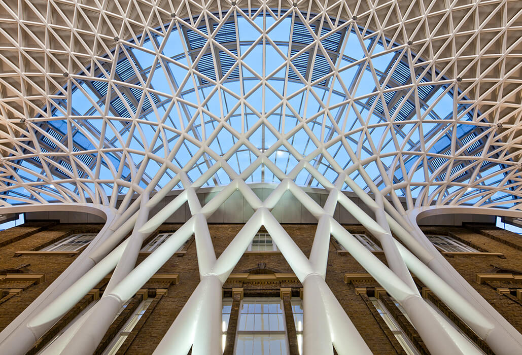 Above the freestanding shell structure the King's Cross Station has an second construction covered with glass and metal panels.